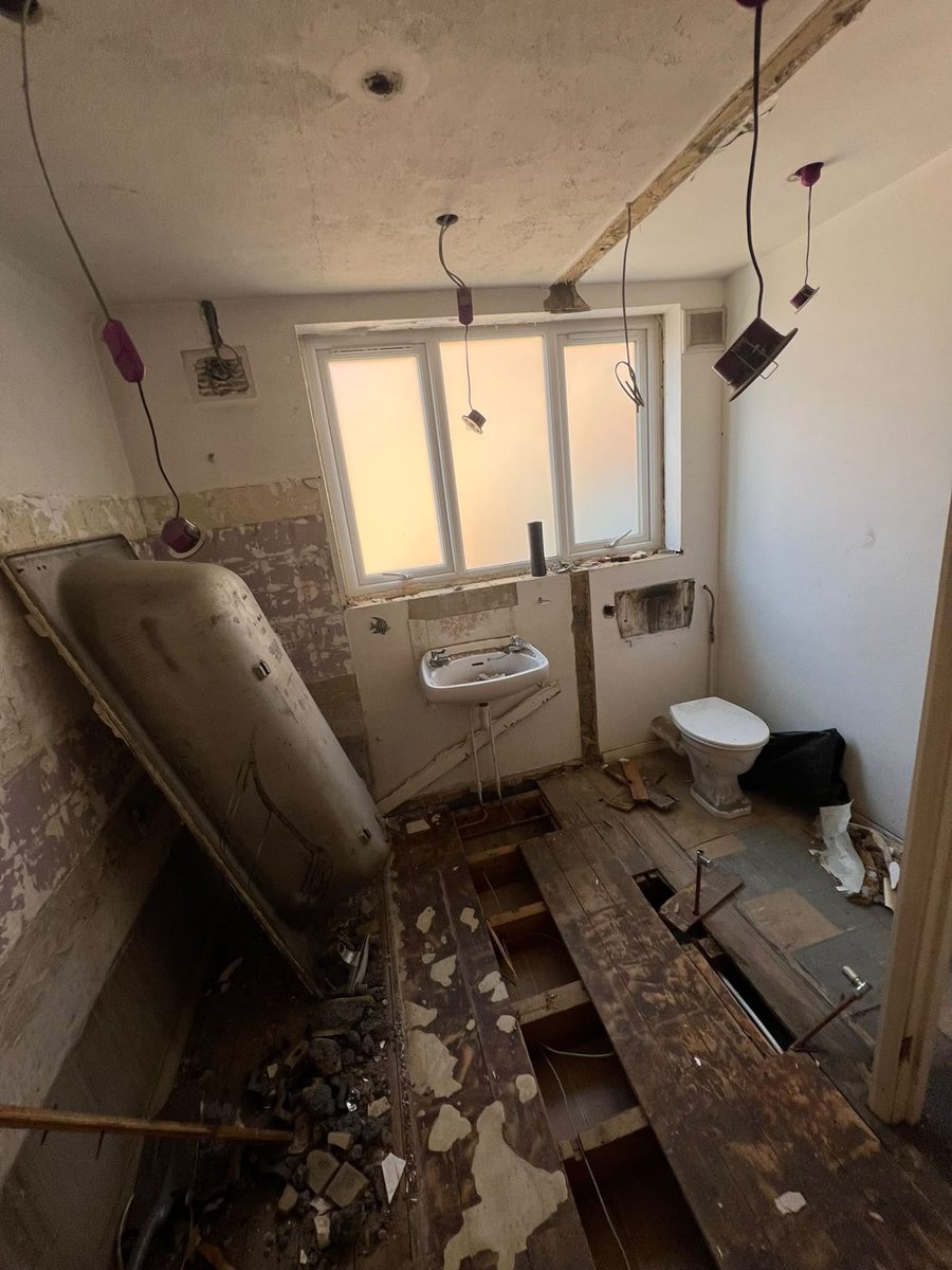 Bathroom stripped back to bare walls and joists before renovation